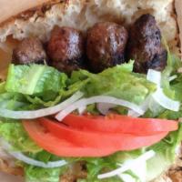 Grilled Beef Meatball Sandwich · Served with lettuce, tomatoes, onion on Turkish bread.