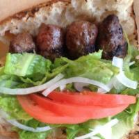 Grilled Beef Meatball Sandwich With Cheese · Served with lettuce, tomatoes, onion on Turkish bread.