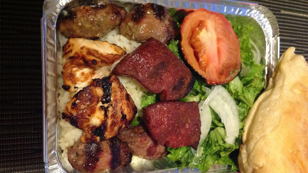 Mixed Platter · Meatball, meatball with cheese, chicken shish kabab, and lamb sausages, serve with house salad, grill tomato, rice pilaf and Turkish bread.