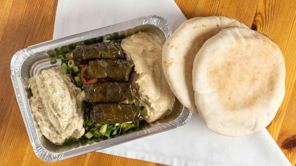 Mix Appetizers Plate · Humus, Baba ghanoush, Turkish salad and stuffed grape leaves serve with two pita bread. Extra bread for additional charge.
