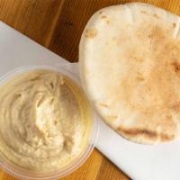 Hummus · Chick peas mashed to paste with lemon juice, garlic and tahini serve with pita bread.