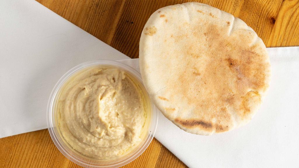 Hummus · Chick peas mashed to paste with lemon juice, garlic and tahini serve with pita bread.