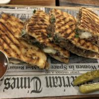 Roasted-Pulled Lamb Meat Panini · Roasted-pulled lamb meat, onions, shredded mozzarella cheese and aragulas.( served with spic...