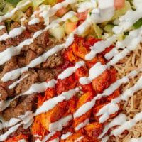 Chicken Over Rice Platter · boneless meat with rice and salad
white sauce hot sauce