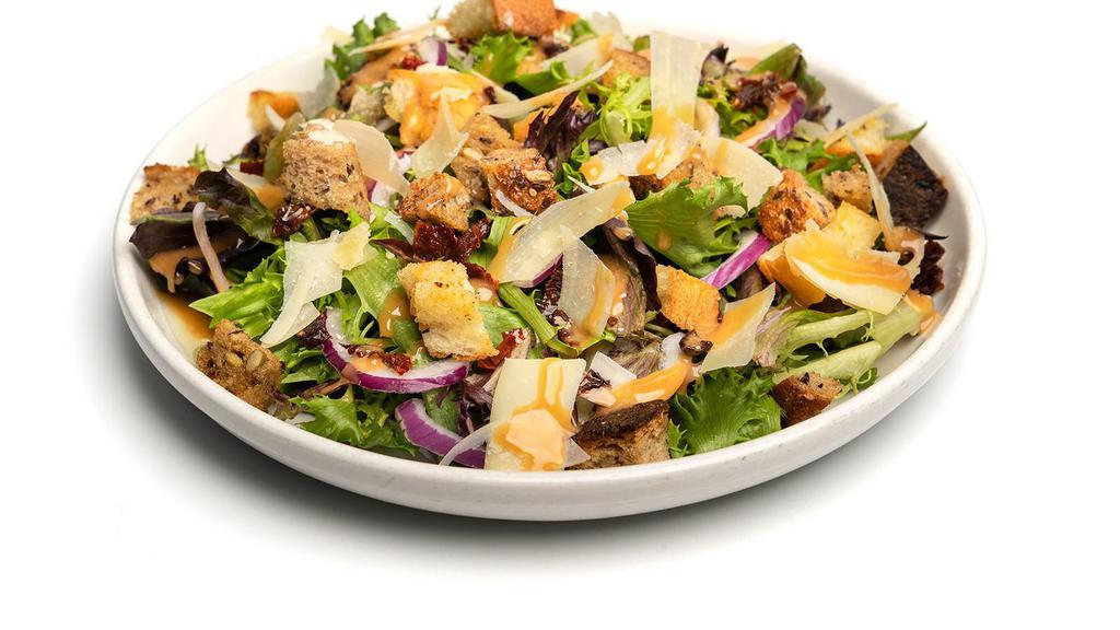 Panzanella · Toasted garlic croutons, red onion, with mesclun, sundried tomatoes, and shaved Parmesan tossed in a balsamic vinaigrette.