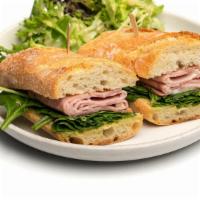 Ham & Brie Baguette · Sliced ham, brie, baby spinach and dijon on baguette.