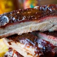 1/4 Rack Ribs · St. Louis Ribs, Dry Rubbed and Slow Smoked, Lightly Glazed with Our Original BBQ Sauce. Incl...