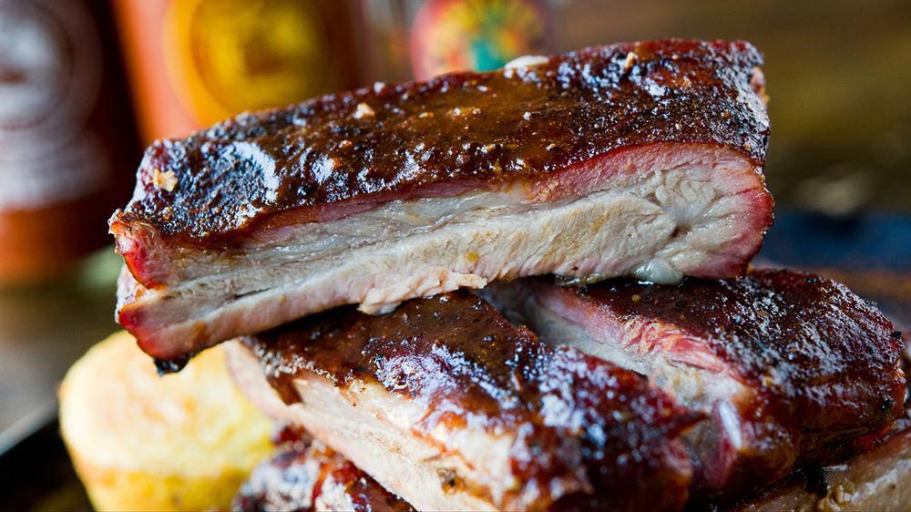 1/4 Rack Ribs · St. Louis Ribs, Dry Rubbed and Slow Smoked, Lightly Glazed with Our Original BBQ Sauce. Includes Two Homemade Sides and Cornbread. GF