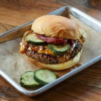 Impossible Burger · Plant Based Burger, Caramelized BBQ Onions, melted cheddar, smoked plum tomatoes, pickle, zi...
