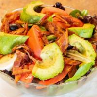 Cobb Salad · Mixed greens, avocado, sweet corn, fresh chopped bacon, tomato, sliced hard boiled egg and c...