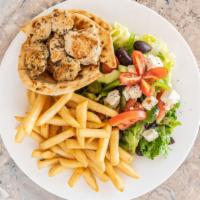 Chicken Souvlaki Platter · Served with Greek salad, French fries, homemade tzatziki sauce and pita.