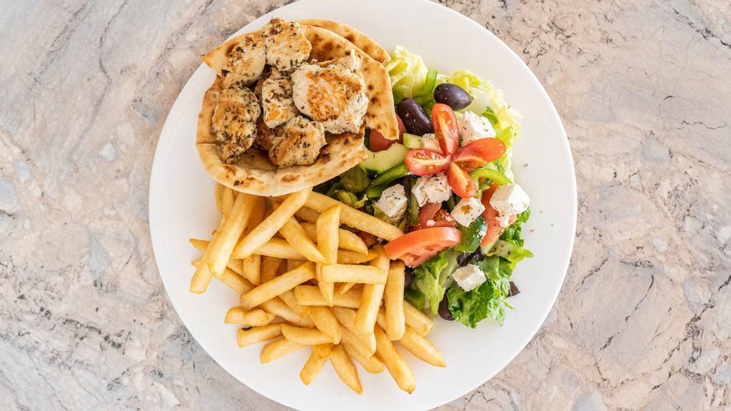 Chicken Souvlaki Platter · Served with Greek salad, French fries, homemade tzatziki sauce and pita.
