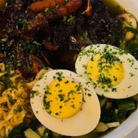 Ramen Bowl (Oxtails) · Ramen noodles, vegetables in broth (may contain mushrooms) and  topped with oxtails and a bo...
