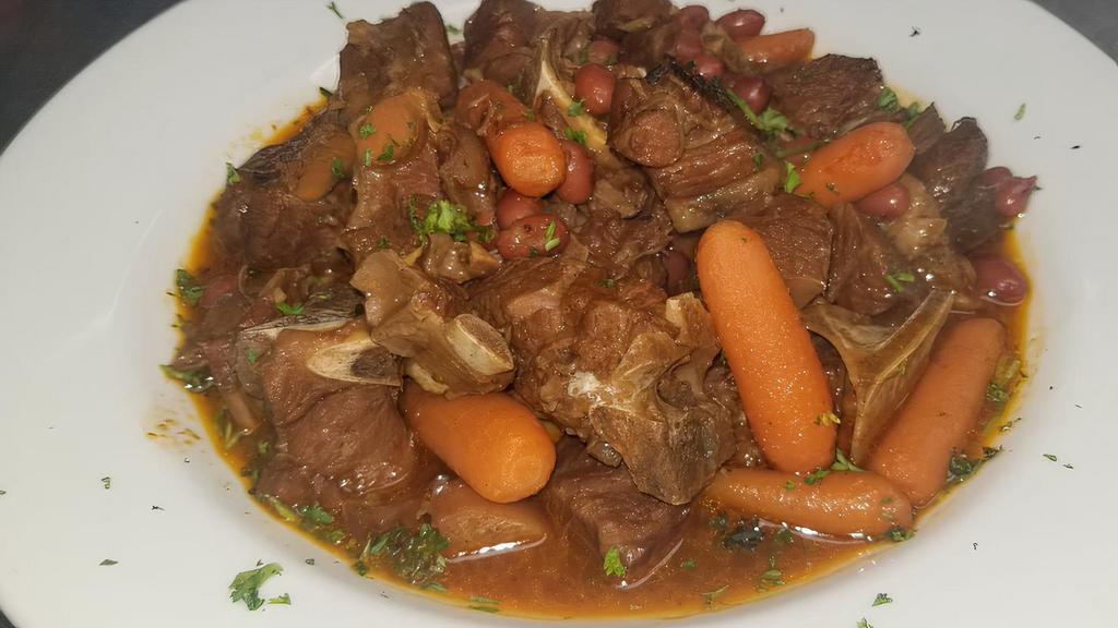 Stew Oxtail · Tender oxtails cooked for hours with baby carrots, butter beans and our special spices