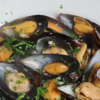 Mussels · Cooked in a garlic, herb, white wine reduction