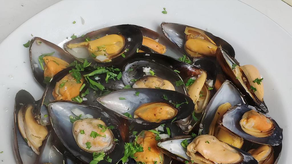Mussels · Cooked in a garlic, herb, white wine reduction