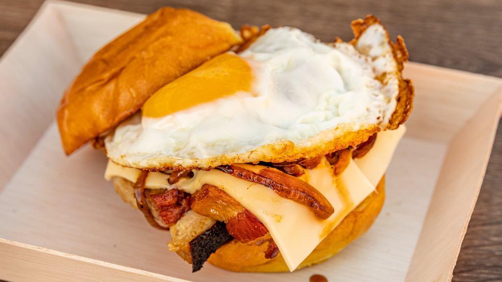 Breakfast Slider · Toasted Sweet Bun, Fried Egg, Cheese, Honey Dijon or Spicy Garlic, and Choice of protein.