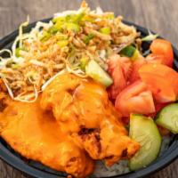 Spicy Chicken Bowl · Rice bowl with spicy garlic chicken, tomato, cucumber, sesame citrus slaw, and crispy onions