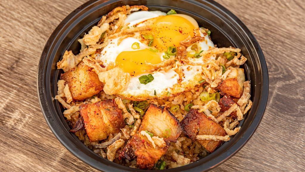 Fried Rice - Add Fried Egg · Fried rice topped with pork belly bites and crisp onions. Finished with fresh green onions.