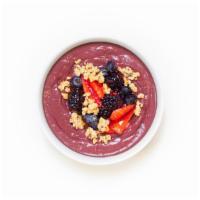 Berry Acai Bowl · Refreshing acai blend topped with granola, strawberries, blackberries, blueberries, and honey.