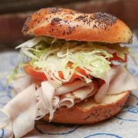 Turkey Club Sandwich · Turkey, bacon, lettuce and russian dressing.