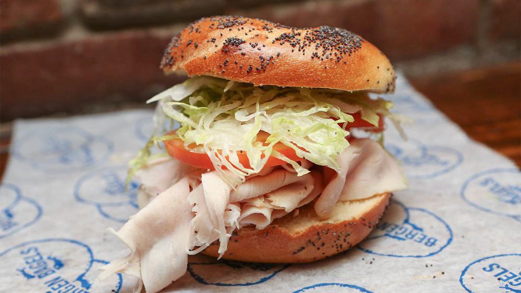 Turkey Club Sandwich · Turkey, bacon, lettuce and russian dressing.