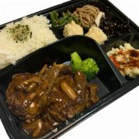 Hamburger Steak Bento	ハンバーグステーキ弁当 · Main dish served with miso soup, house salad, rice and side dishes.