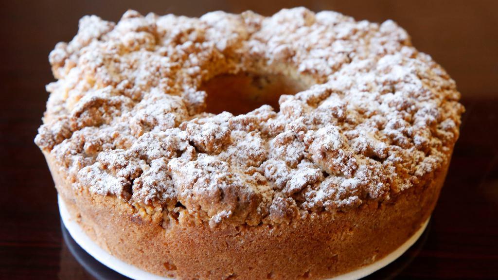 Dutch Apple Cake · Moist vanilla cake filled with cinnamon apples and topped with streusel.