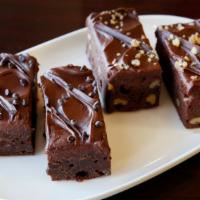 Walnut Brownies · Fudgy iced brownies laced and topped with walnuts.