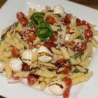 Caprese Pasta Salad · Penne, mozzarella, basil, tomatoes, onions, Parmigiano and extra virgin olive oil.