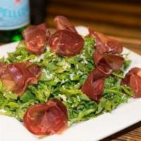 Bresaola Salad · Arugula, bresaola, Parmigiano, lemon dressing and extra virgin olive oil.