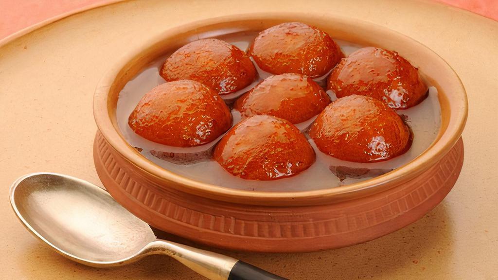 Gualab Jamun · A light pastry dumpling made from dry milk and honey.