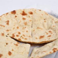 Roti · Slightly thick Indian flat bread or wheat bread made from open flame or wheat bread made fro...