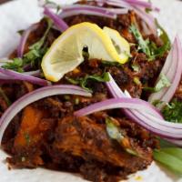 Koli Milagu Varuval (Pepper Chicken) · Hot. Peppercorn flavored dry chicken.