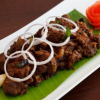 Goat Sukka Varuval (Bone-In) · Hot and spicy chettinad appetizer.