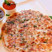 Uthappam · Thick rice & lentil pancake topped with chopped onions or tomatoes or chilies or any combina...