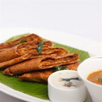 Mysore Dosa · Rice & lentil crepe served, Mysore chutney spread.