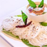 Idiyappam · Four string hoppers made of fermented rice batter.