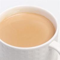 Masala Chai · Tea traditionally blended with ginger, cardamom, sugar and milk.