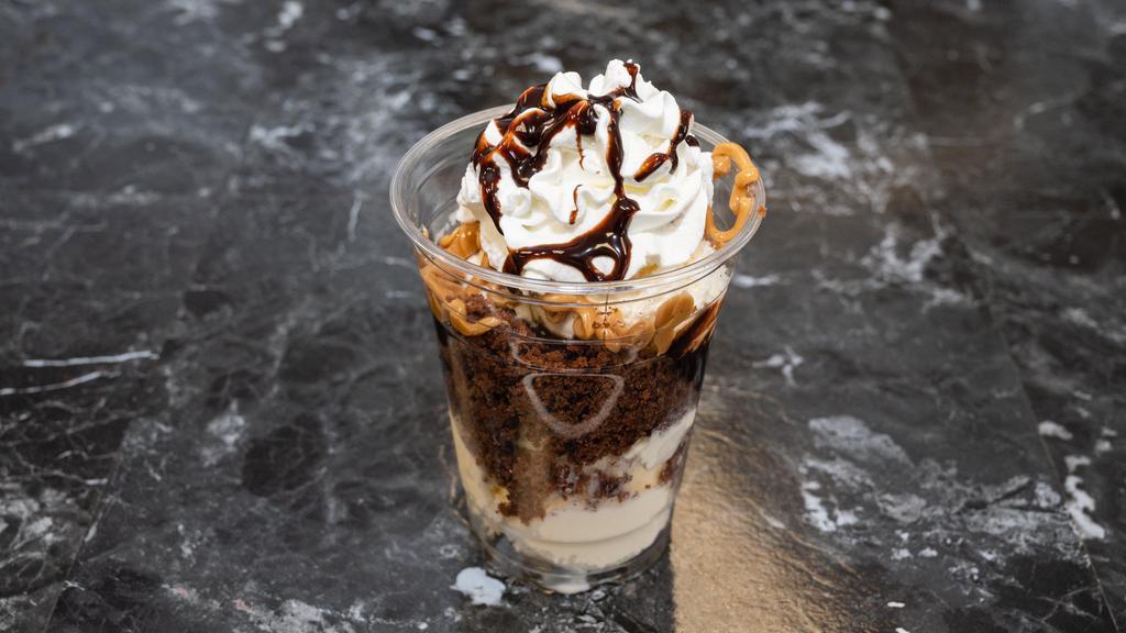 Brownie Parfait · Vanilla scoops of ice cream followed by PB, Caramel and Hot Fudge and lots of brownie!