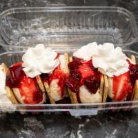 Cheesecake S'Mores · Strawberry Cheesecake ice cream between graham crackers with strawberry sauce and whipped cr...