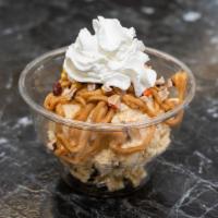 Peanut Butter Madness · PB Pie ice cream with PB sauce, Reese pieces whipped cream and chocolate drizzle.