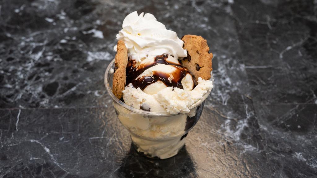 Cookie Lovers · Scoops of Vanilla and cookie dough ice cream with warm chocolate chip cookie pieces whipped cream and chocolate drizzle.