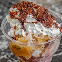 Brownie Bites · Scoops of Chocolate and Sea Salt Caramel ice cream with warm brownie pieces, whipped cream a...