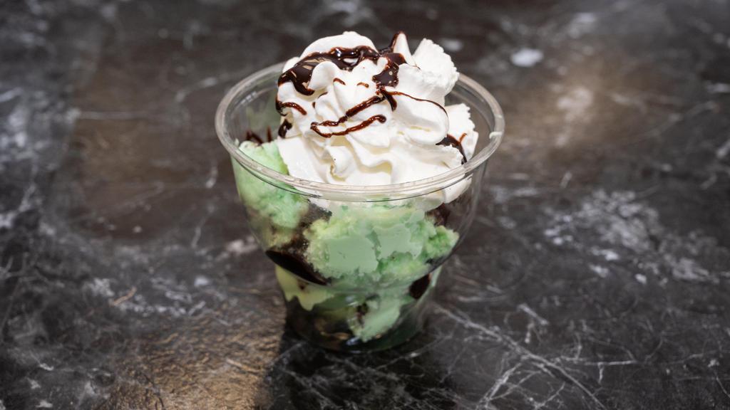 Mint Fudge · Mint Chocolate Chip Ice Cream with hot fudge, Oreos and whipped cream.