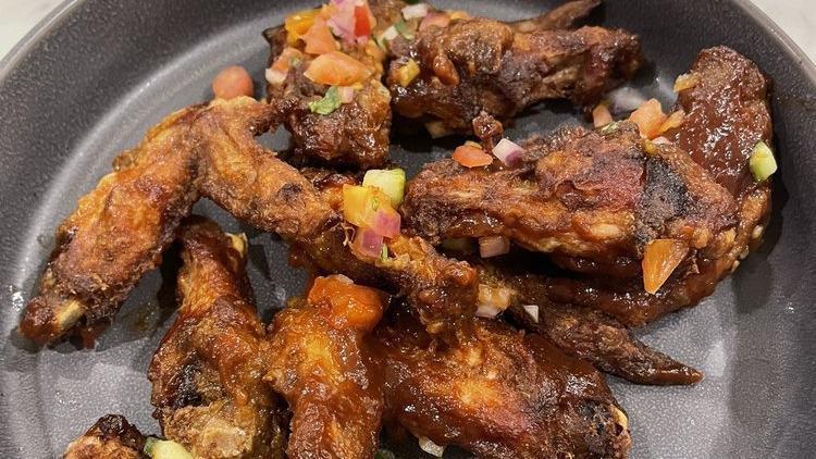Voodoo Chicken Wings With Bourbon Bbq Sauce · Mild. Jay's voodoo spice mix , Jay's bourbon BBQ sauce, tomato-cucumber salad. Dairy-free / GF.