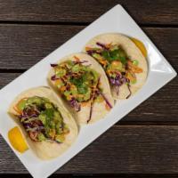 Fish Tacos · Blackened seared mahi-mahi, purple cabbage-carrot slaw, salsa verde, chipotle aioli, sesame ...