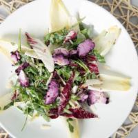 Arugula · Roasted beets, pickled red onions, goat cheese, toasted almonds,  tossed in a berry vinaigre...