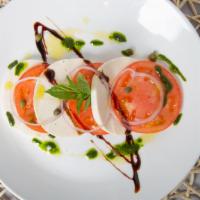 Caprese · Beefsteak tomato, fresh mozzarella, pickled red onion, capers and fresh basil drizzled with ...