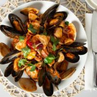 Linguine Seafood · Shrimp, mussels, clams and calamari in a garlic white wine tomato sauce.topped with spicy Ca...